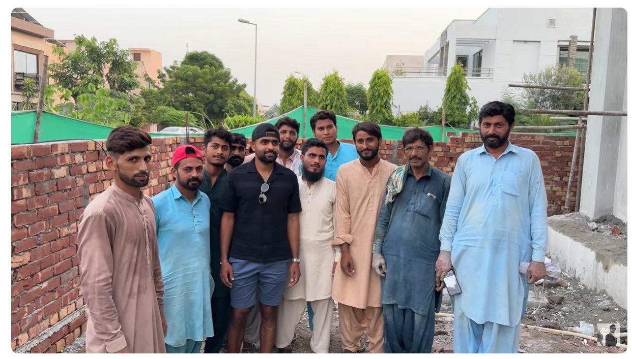 Babar Azam posed with labours who are working on the construction site of his new home